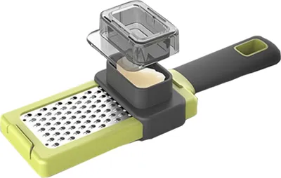 A grater with a container for grated food and a handle.