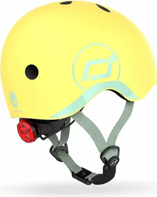 A yellow helmet with a red light attached to the back.
