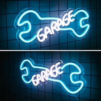 A neon sign shaped like a wrench with the word 'GARAGE' in the center, displayed against a tiled background.