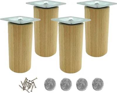 Four wooden furniture legs with metal top plates and a pile of screws and felt pads.