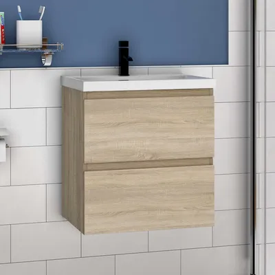 A bathroom vanity with a sink and faucet against a blue wall and white tiled background.