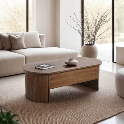 A modern living room with a sectional sofa and an oval coffee table.