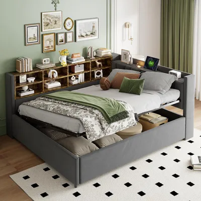 A bedroom scene featuring a grey upholstered daybed with a built-in bookshelf headboard.