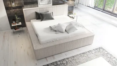 A modern bedroom with a bed, nightstand, and rug.