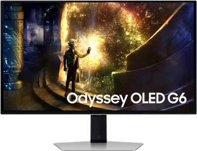 A computer monitor displaying a futuristic scene with a person reaching out towards a glowing orb. The monitor has the 'Odyssey OLED G6' branding on the screen.