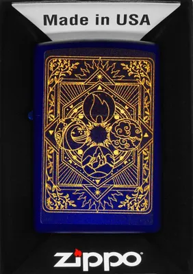 A Zippo lighter with an elemental design is presented in its packaging.
