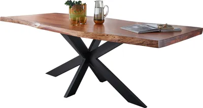 A wooden dining table with a live edge and a black metal base.