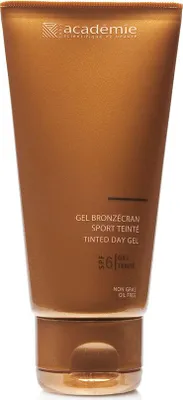 A close-up, front-facing studio shot of a bronze-colored squeeze tube of tinted day gel, with the brand logo and product details visible.