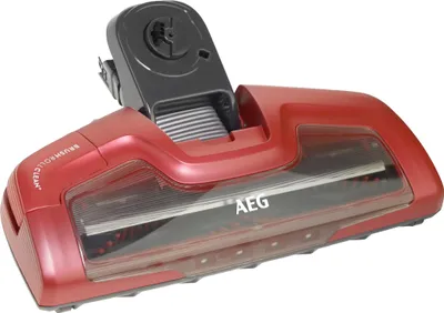 A red and black vacuum cleaner floor head with the AEG logo visible.