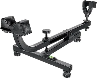 A black metal shooting rest with padded supports for a rifle.