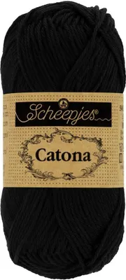 A ball of black yarn with a label.