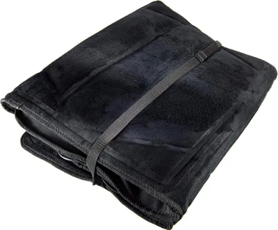 A folded black massage mat with a strap.