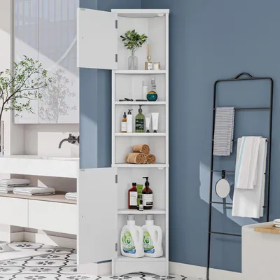 A white corner cabinet with open shelves and closed doors, filled with bathroom products, placed in a bathroom setting.