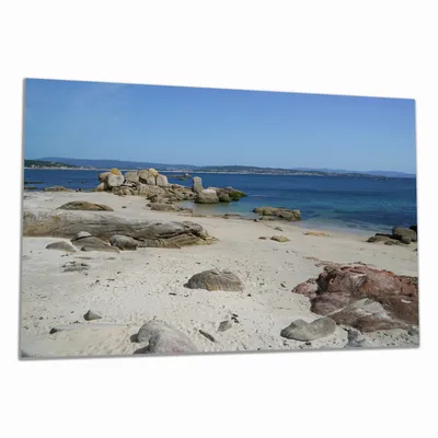 Produktbild von Wallario Herdabdeckplatte aus Glas, Größe 80 x 52 cm 1-teilig, Motiv Felsen auf einem Sandstrand