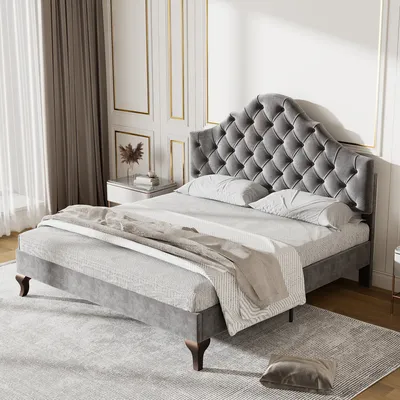 A bedroom scene with a bed as the main focus.