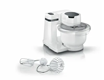 A white Bosch stand mixer with its attachments displayed in front of it, on a white background.