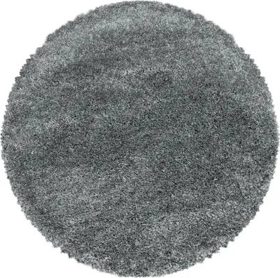 A round, gray shaggy rug on a white background.