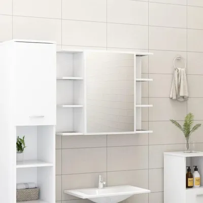 A bathroom scene featuring a white medicine cabinet with a mirror and shelves, a sink, and a small cabinet on the right.