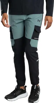 A person wearing Under Armour Tech Utility Woven Joggers.