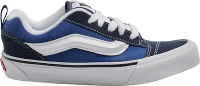 A side view of a blue Vans sneaker against a white background.