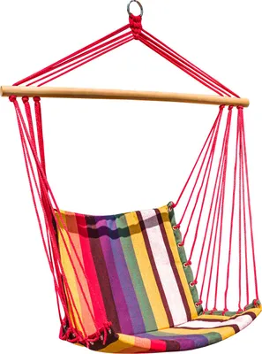 A colorful striped hanging chair suspended by red ropes from a wooden bar.