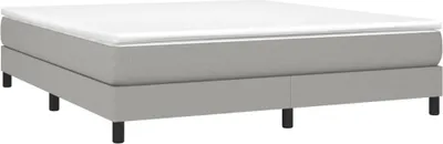 A light gray upholstered bed frame with a white mattress is shown against a white background.
