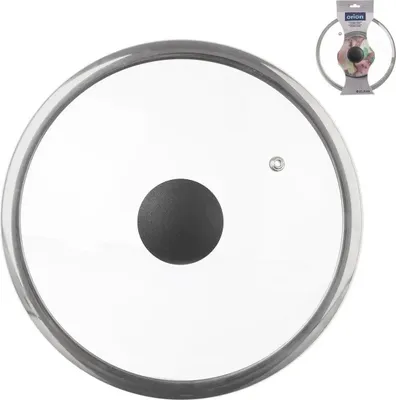 A glass pot lid with a black handle and a silver rim, shown from a top-down perspective. A small packaging insert is visible in the upper right corner.
