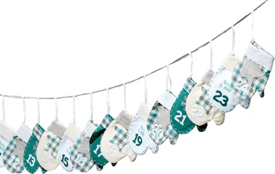 A string of fabric advent calendar pouches shaped like mittens, hanging on a string.