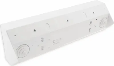 The back of a white, rectangular electrical outlet strip with multiple sockets and two USB ports.