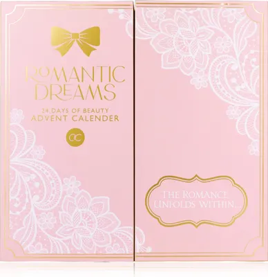 A pink advent calendar box with gold lettering and white lace-like floral designs.