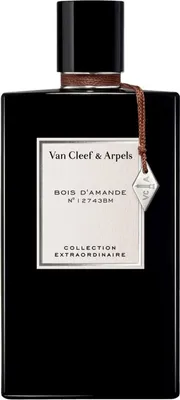 A black bottle of perfume with a white label and a brown string attached to a small metal tag.