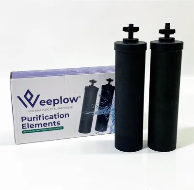 Two black water filter cartridges stand next to a box of Weeplow Purification Elements.