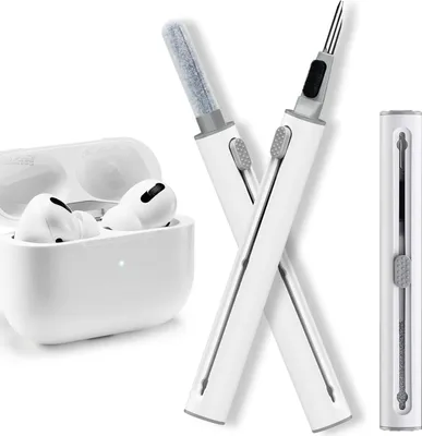 A white cleaning kit for AirPods and their charging case, with the AirPods and case visible in the background.