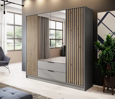 A modern bedroom with a large wardrobe featuring mirrored doors and wooden slats, a chair, and a plant.