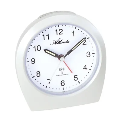 A white alarm clock with a silver trim is shown against a white background.
