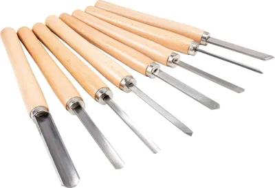 A set of wood carving tools arranged diagonally on a white background.