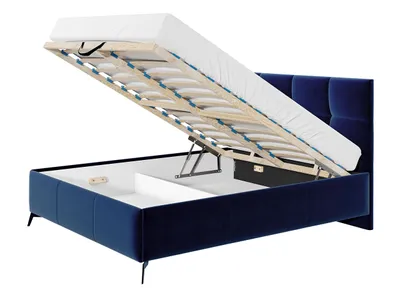 A blue upholstered bed frame with the mattress and base lifted to reveal the storage compartment underneath.