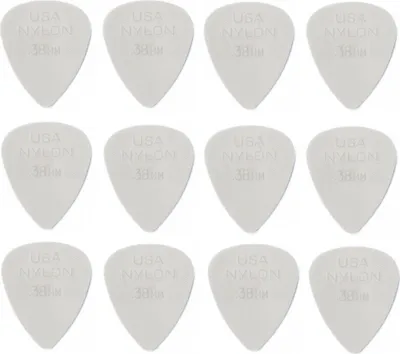 A grid of 12 white guitar picks, each with text printed on it.