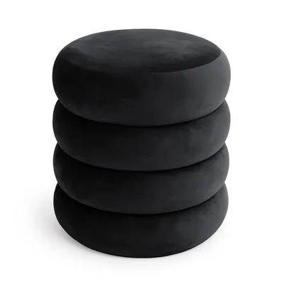 A stack of four black, round, velvet ottomans.