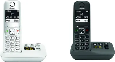 Two cordless phones, one white and one dark gray, are shown on their charging bases against a white background.