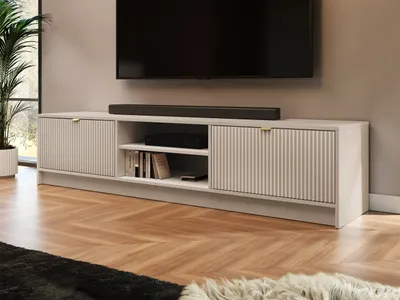 A modern living room with a TV and entertainment center.