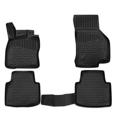 A set of four black rubber car floor mats arranged on a white background.