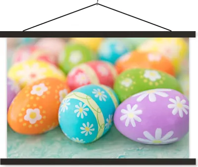 Produktbild von MuchoWow® Textilposter Bunte Ostereier auf einem Ostertisch 120x80 cm mit schwarzem Rahmen - Wanddeko