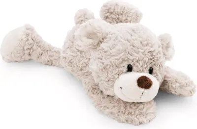 A plush teddy bear lying on its stomach.