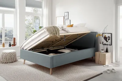 Produktbild von Meise Möbel Stauraumbett Frieda 140x200 cm | Bettkasten & Lattenrost | Webstoff Eisblau | Holzfuß eichefarbig
