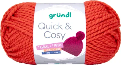 A ball of orange yarn with a label showing product information and an illustration of a hat.