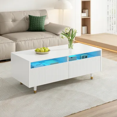 Produktbild von Moderner LED-Couchtisch mit gewellter Schubladenplatte, gold-weißen Beinen, zwei Schubladen und farbwechselndem LED-Lichtstreifen