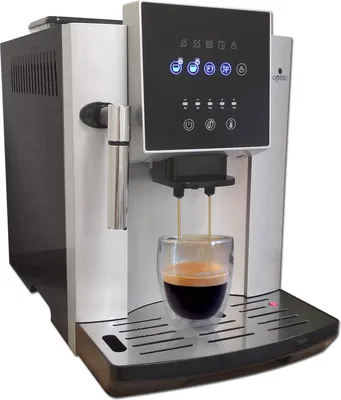 A coffee machine is brewing espresso into a glass cup.