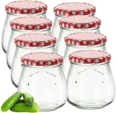 A group of empty glass jars with red and white checkered lids.