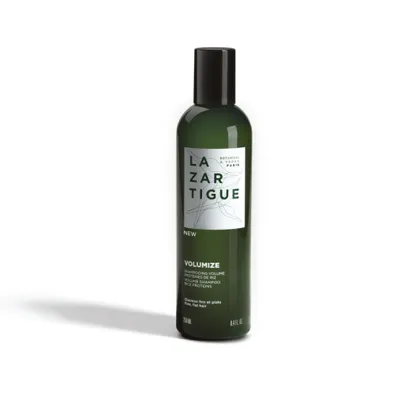 A product shot of a green bottle of shampoo with a white label.